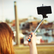 Illustration for article titled Selfie Stick Shuts Down Ride at Theme Park